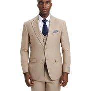 Man wearing a beige suit with a blue tie and pocket square on a white background